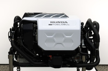 Closeup of Honda Fuel Cell engine on a stand. 