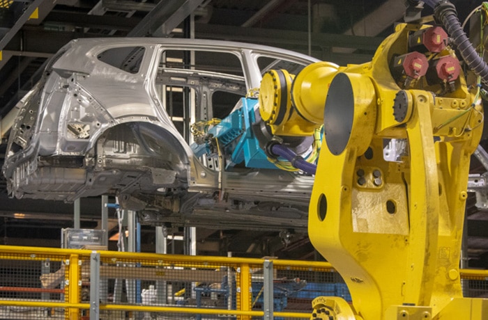 Metal is stamped to form a new Honda frame.