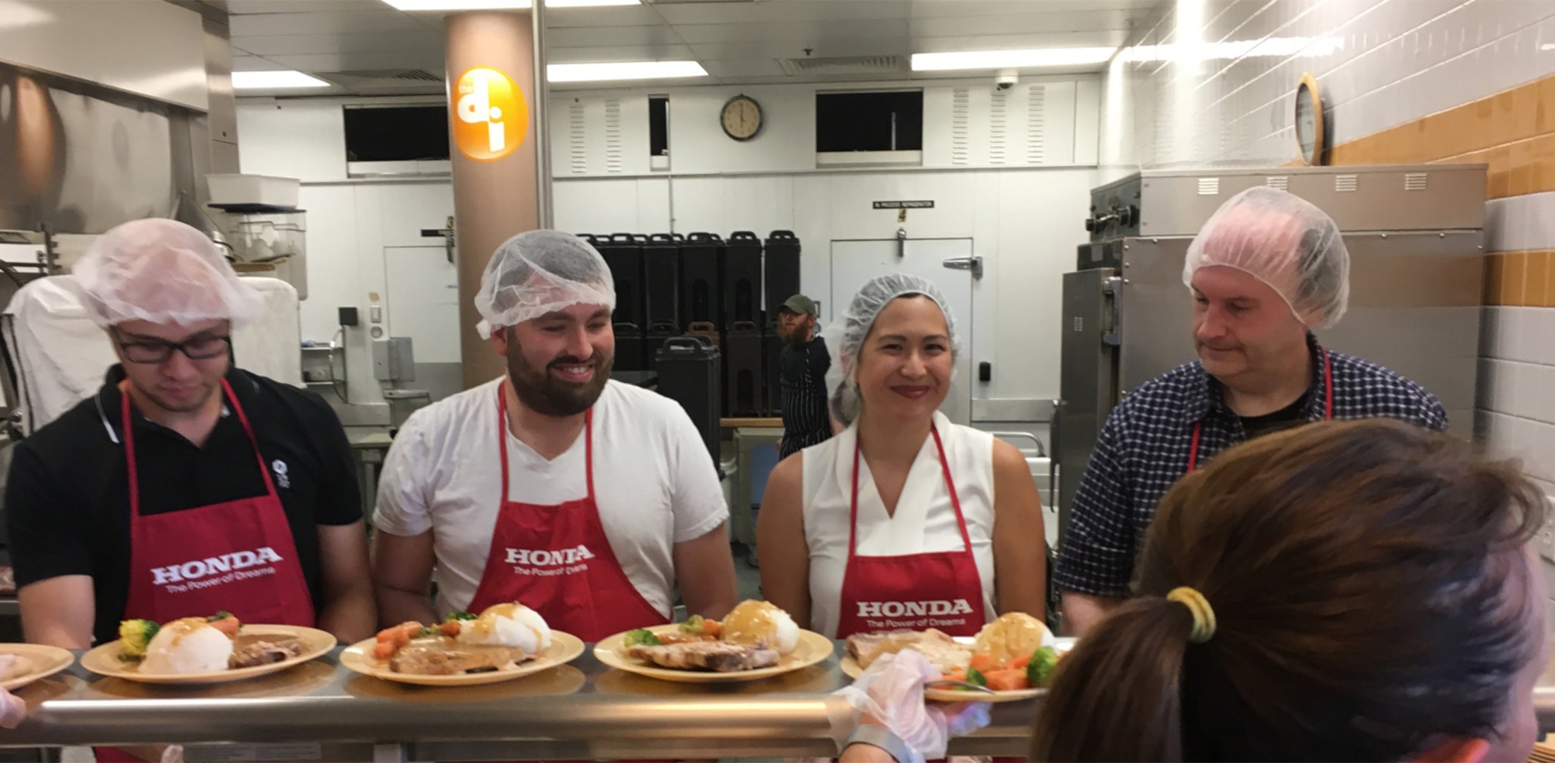 Honda associates serving food.